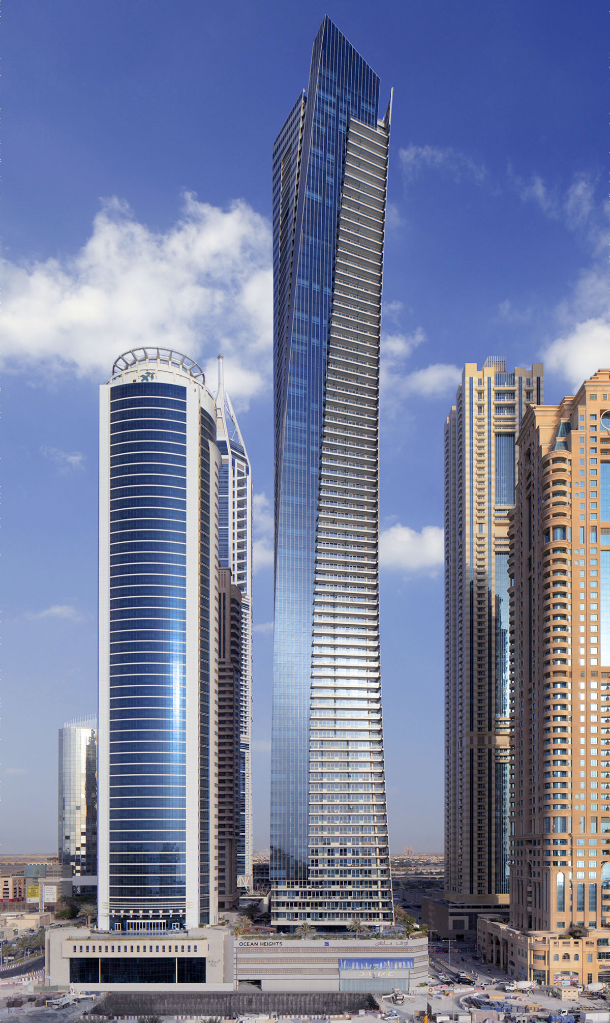 Ocean Heights with its blue glass facade and balconies, next to neighbouring towers